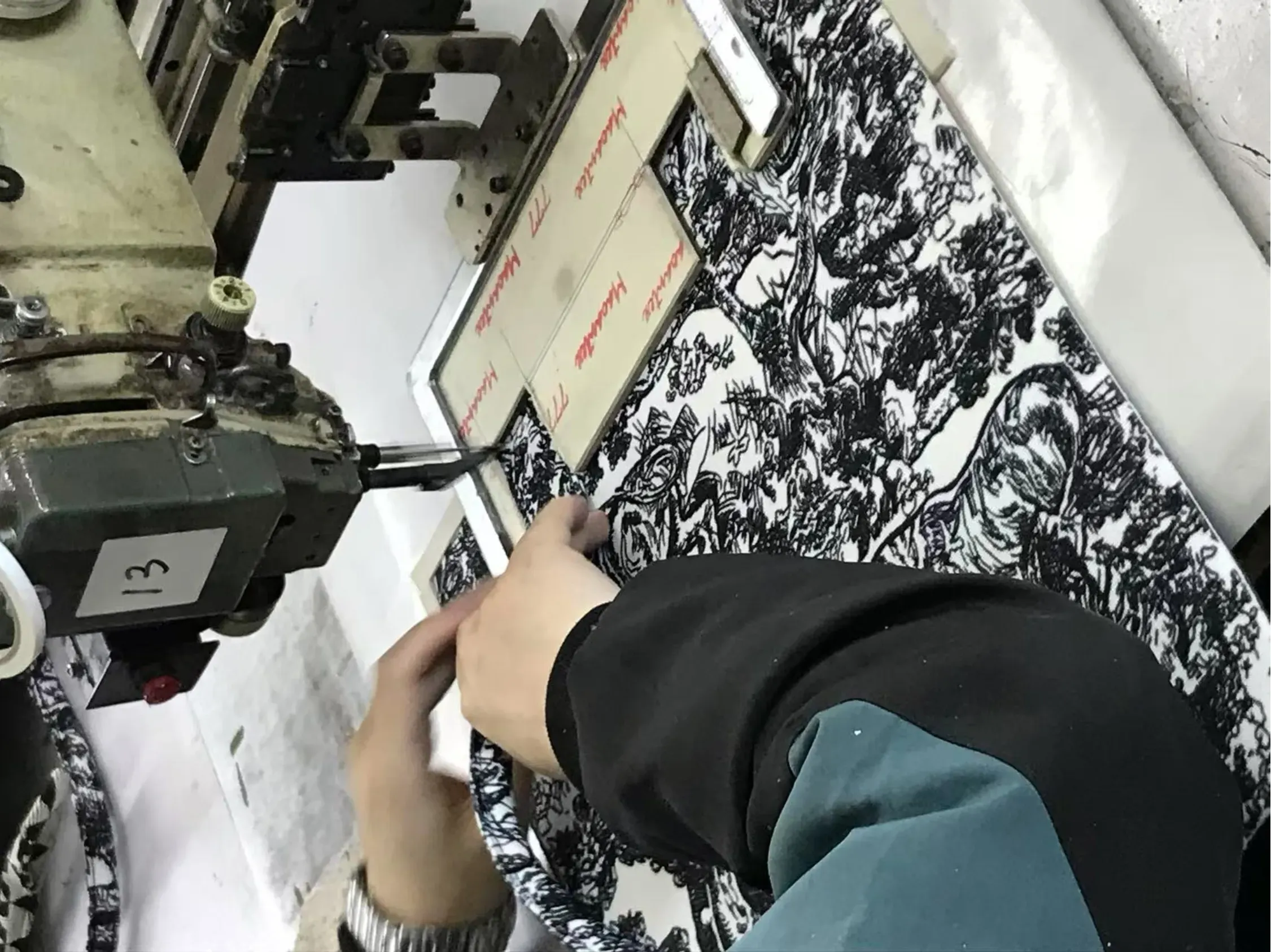 Custom handbags moving through controlled bulk production at Veggance