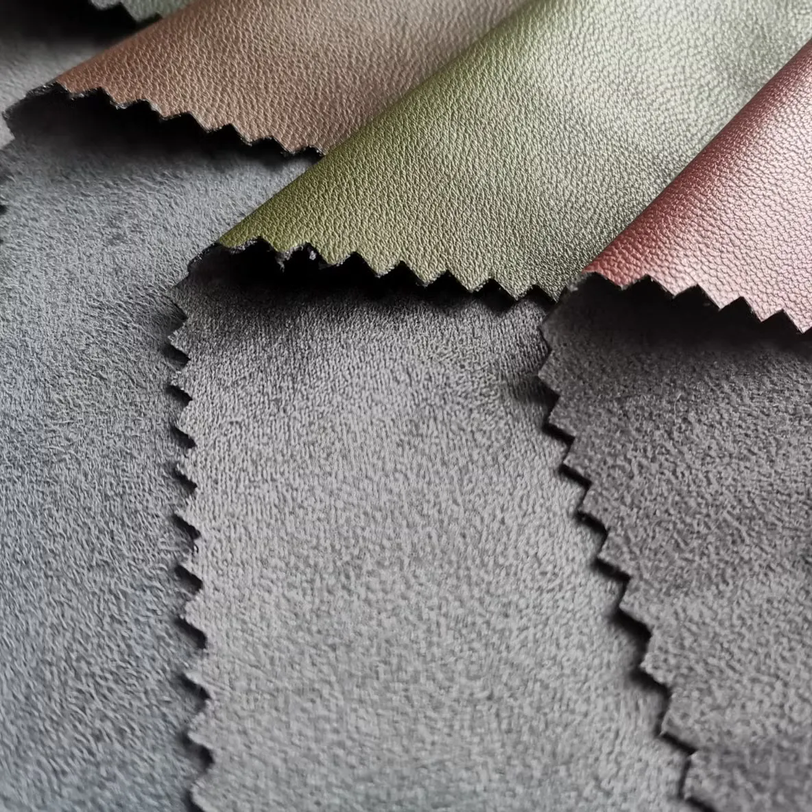 Muted recycled and water-based PU material swatches for sustainable handbag development