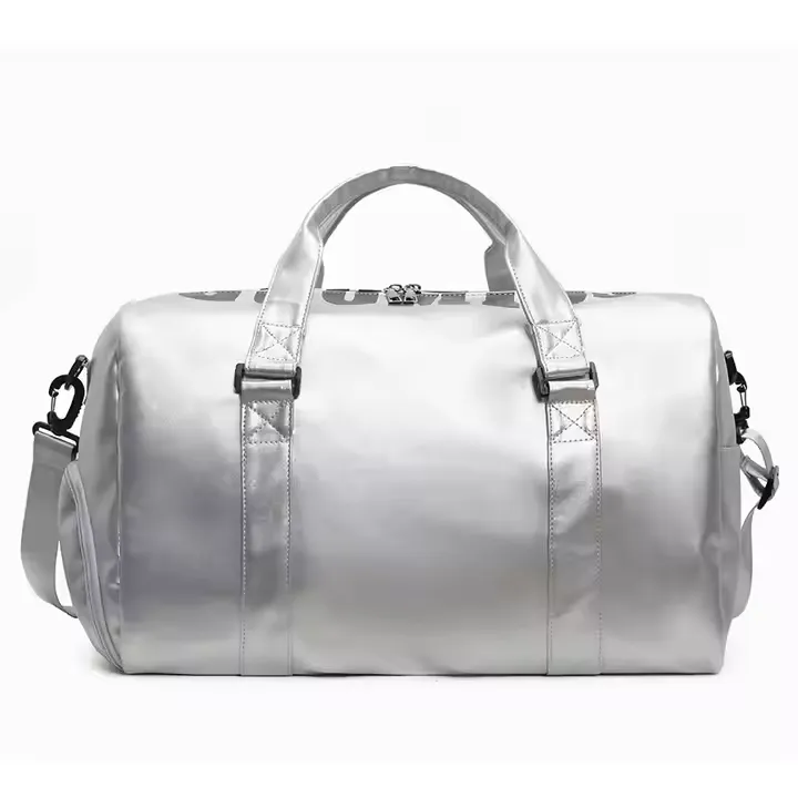 A sleek custom duffle bag with a futuristic silver metallic finish, featuring dual handles, a detachable shoulder strap, and a secure zipper closure. This spacious design is ideal for travel, gym, or weekend getaways.