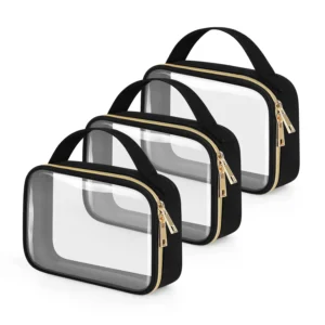 A set of three clear, zippered toiletry bags in small, medium, and large sizes, arranged in a neat row against a white background. Each bag features transparent PVC sides, black fabric trim, a top handle, and elegant gold-colored zippers. This type of clear case, particularly the medium one, is often marketed as a TSA Approved quart size bag, designed for carrying liquids and toiletries through airport security.