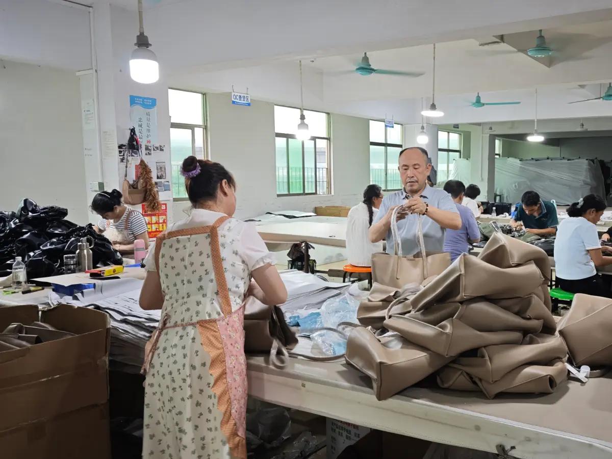 Veggance factory team manufacturing custom vegan leather bags