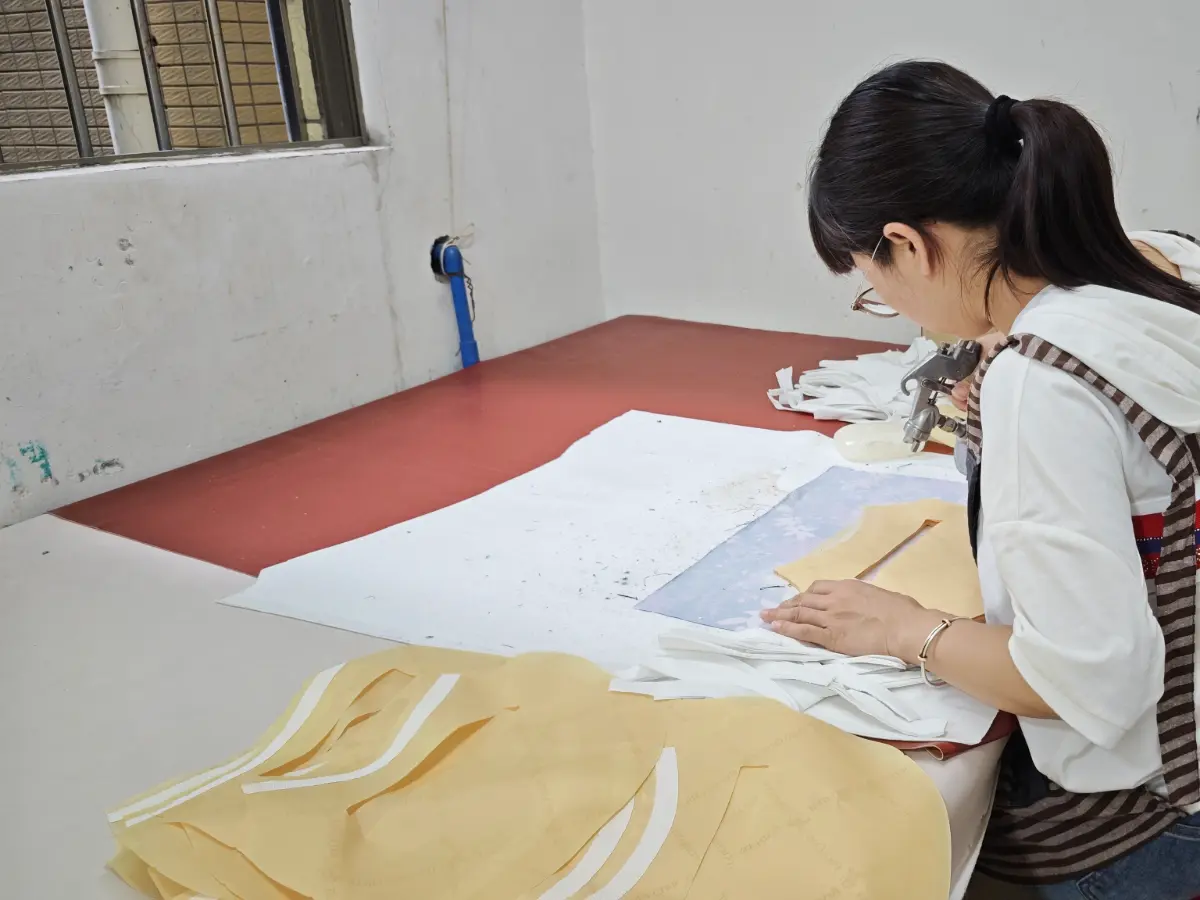 Veggance pattern maker preparing handbag patterns during sample development